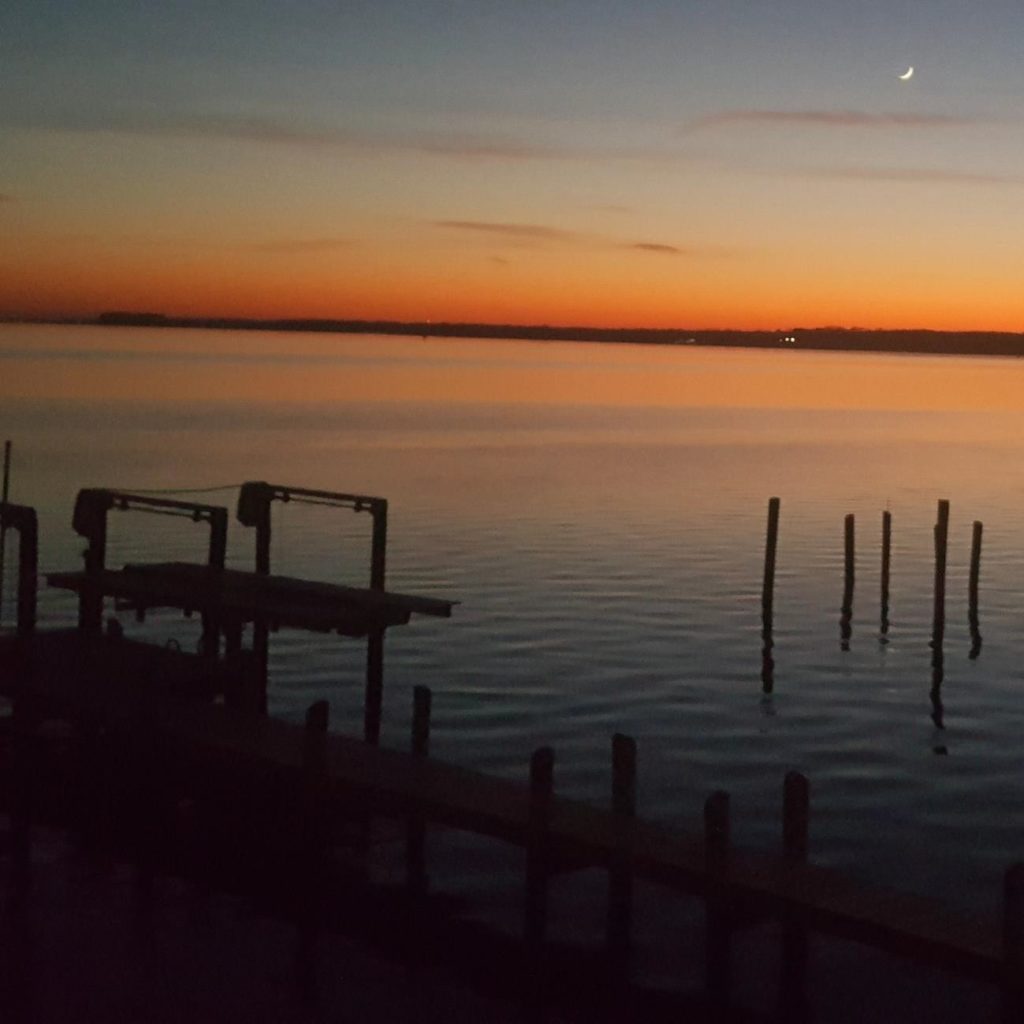 A new moon and sunset over Chincoteague as seen from Cove’s Point. 