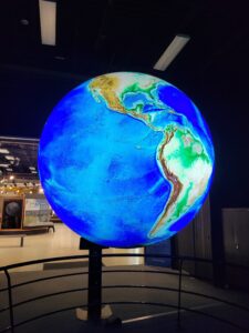 large illuminated globe exhibit in a museum