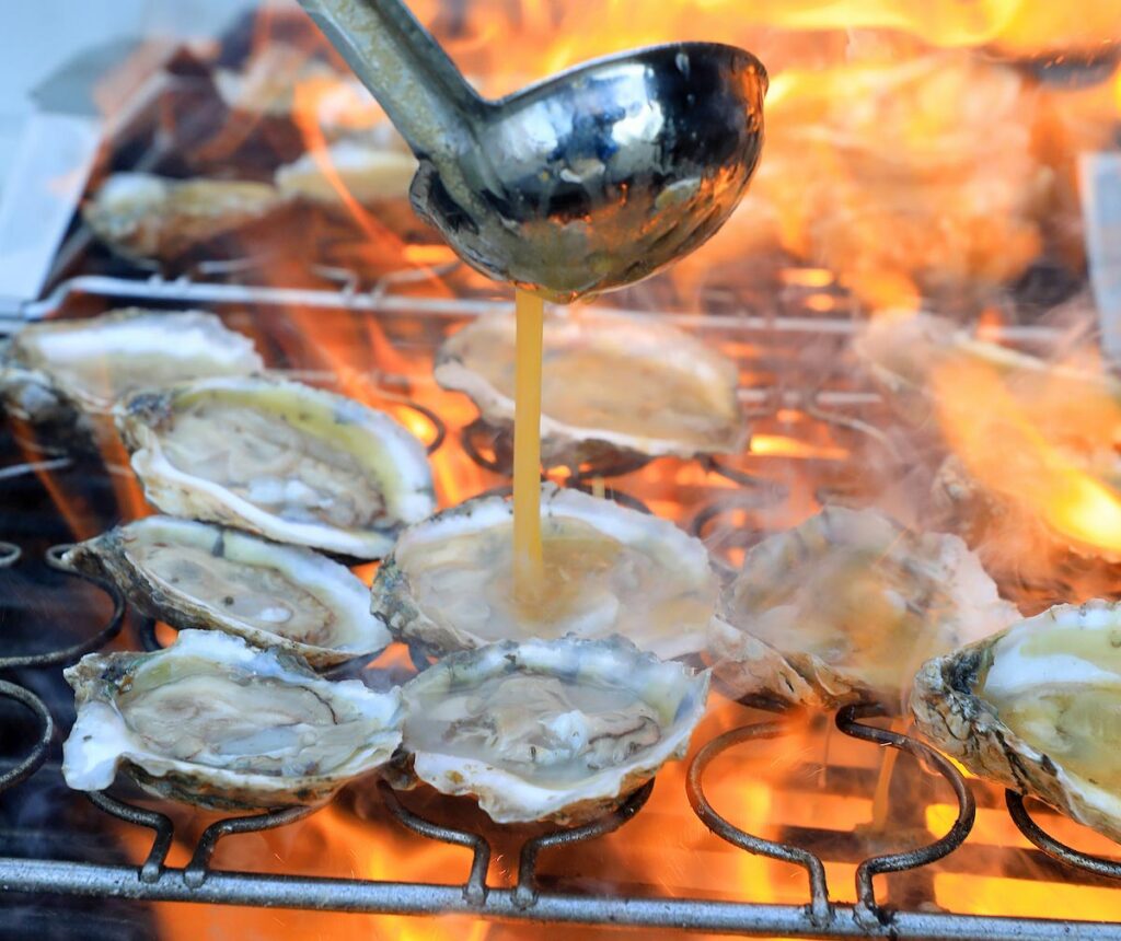 Serving up fresh oysters after a public tour at Oyster Seed Holdings